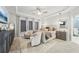 Spacious main bedroom featuring a tray ceiling, cozy seating, plush carpet, and ambient lighting at 2764 Bateman Sw St, Powder Springs, GA 30127