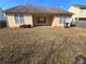 A large backyard with a view of the home's rear exterior at 3121 Baywood Ct, Conyers, GA 30013