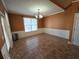 Inviting dining room with elegant chandelier and decorative wainscoting at 3121 Baywood Ct, Conyers, GA 30013