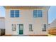 Home featuring an exterior wall and a door to the backyard and a fence at 433 Kara Ln, Mcdonough, GA 30253