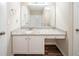 Bright bathroom featuring a white vanity with granite countertops and a large mirror at 433 Kara Ln, Mcdonough, GA 30253