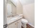 Charming half-bath with granite countertop and a wood-look floor at 433 Kara Ln, Mcdonough, GA 30253