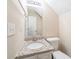 Bright bathroom featuring granite countertop, white cabinets, and neutral wall color at 433 Kara Ln, Mcdonough, GA 30253