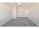 Spacious carpeted bedroom with a ceiling fan, two closets, and neutral decor at 433 Kara Ln, Mcdonough, GA 30253