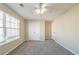 Bright bedroom with plush carpeting, a ceiling fan, and ample natural light at 433 Kara Ln, Mcdonough, GA 30253