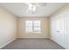 Comfortable bedroom with plush carpet, ceiling fan, and double door closet at 433 Kara Ln, Mcdonough, GA 30253