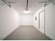 Empty garage with automatic door and white walls at 433 Kara Ln, Mcdonough, GA 30253