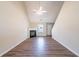 Inviting living room includes a cozy fireplace, modern ceiling fan, hardwood flooring, and ample natural light at 433 Kara Ln, Mcdonough, GA 30253