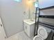 Bathroom featuring vanity with quartz countertop, toilet and shelves at 827 Winslow Nw Way, Atlanta, GA 30318