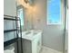 Modern bathroom with vanity, gray walls, and bright lighting at 827 Winslow Nw Way, Atlanta, GA 30318