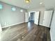 Bright bedroom with hardwood floors and double doors leading to outdoor space at 827 Winslow Nw Way, Atlanta, GA 30318