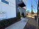Townhome entrance with painted brick, minimalist black awning, and tasteful landscaping at 827 Winslow Nw Way, Atlanta, GA 30318