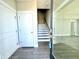 Entryway featuring hardwood floors, a staircase, and a glimpse into the bright interior at 827 Winslow Nw Way, Atlanta, GA 30318