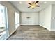 Bright living room featuring hardwood floors, recessed lighting, and a ceiling fan at 827 Winslow Nw Way, Atlanta, GA 30318
