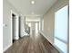 Open living room featuring hardwood floors, recessed lighting, and stairs to upper floor at 827 Winslow Nw Way, Atlanta, GA 30318