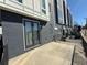 Spacious patio with brick siding, black railing, and outdoor access at 827 Winslow Nw Way, Atlanta, GA 30318