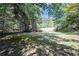 Large backyard with fence and mature trees at 2133 Creekview Trl, Decatur, GA 30035