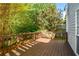 Wooden deck perfect for outdoor gatherings, surrounded by lush greenery at 2133 Creekview Trl, Decatur, GA 30035