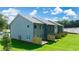 Back view of new townhomes with fenced-in patios and large green space at 340 Sinclair Ct, Mcdonough, GA 30253