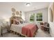 Cozy bedroom with natural light, stylish decor, and comfortable furnishings at 340 Sinclair Ct, Mcdonough, GA 30253