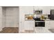 A well-organized kitchen with a pantry, modern appliances, granite countertops, and ample storage for culinary essentials at 340 Sinclair Ct, Mcdonough, GA 30253