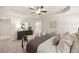 Bright main bedroom with a ceiling fan, sitting area, and a beautiful dresser and mirror at 340 Sinclair Ct, Mcdonough, GA 30253