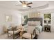 Serene main bedroom suite with a tray ceiling, plush bedding, and coordinated decor for a relaxing retreat at 340 Sinclair Ct, Mcdonough, GA 30253