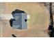Overhead shot of the home with a well-maintained roof, long driveway, and spacious, empty yard at 3577 N Winds N Trl, Douglasville, GA 30135