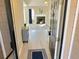 Inviting entryway featuring light wood floors leading to the living room with a fireplace at 3577 N Winds N Trl, Douglasville, GA 30135