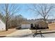 Charming single Gathering home featuring a two-car garage and well-maintained front yard with mature trees at 3577 N Winds N Trl, Douglasville, GA 30135