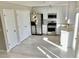 Modern kitchen with stainless steel appliances and white cabinets, offering style and functionality at 3577 N Winds N Trl, Douglasville, GA 30135