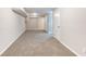 Spacious basement offering neutral carpet, lighting, and a versatile living space at 3761 Turner Heights Dr, Decatur, GA 30032