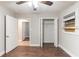 This bedroom features a ceiling fan, closet, and a window with wood covering at 3761 Turner Heights Dr, Decatur, GA 30032