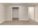 Bedroom with neutral walls, carpet, and closet with open double doors at 3761 Turner Heights Dr, Decatur, GA 30032