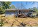 Exterior view of home with a wooden deck and stairs to the backyard at 3761 Turner Heights Dr, Decatur, GA 30032