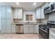 Modern kitchen featuring stainless steel appliances, granite countertops, and ample cabinet space at 3761 Turner Heights Dr, Decatur, GA 30032