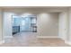 Open-concept living space featuring wood-look flooring leading into the kitchen with stainless steel appliances at 3761 Turner Heights Dr, Decatur, GA 30032