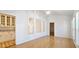 Dining room with hardwood floors and lots of light from the large windows at 4875 Gladstone Pkwy, Suwanee, GA 30024