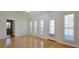 Dining room with hardwood floors and lots of light from the large windows and doors at 4875 Gladstone Pkwy, Suwanee, GA 30024
