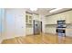 Updated kitchen with white cabinets, granite countertops, and stainless steel appliances at 4875 Gladstone Pkwy, Suwanee, GA 30024