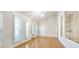 Bright living room with hardwood floors and lots of light from the large shuttered windows at 4875 Gladstone Pkwy, Suwanee, GA 30024