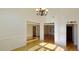 Open floor plan highlights the hardwood floors and natural light throughout the space at 4875 Gladstone Pkwy, Suwanee, GA 30024