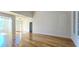Bright living room featuring gleaming hardwood floors and a view of the home's entry at 4875 Gladstone Pkwy, Suwanee, GA 30024