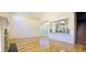 Bright living room features hardwood floors, fireplace and an open concept kitchen with stainless steel appliances at 4875 Gladstone Pkwy, Suwanee, GA 30024