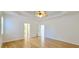 Spacious main bedroom with hardwood floors, tray ceiling and connecting bathroom at 4875 Gladstone Pkwy, Suwanee, GA 30024