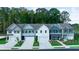 Charming new construction townhomes featuring varied colors and attached garages at 541 Tuskegee St, Mcdonough, GA 30253