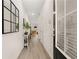 Bright entryway with light wood floors and decor at 549 Tuskegee St, Mcdonough, GA 30253