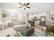 Open floor plan living room and kitchen with modern furnishings at 549 Tuskegee St, Mcdonough, GA 30253