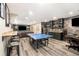 Finished basement with a blue ping pong table, bar area, and entertainment space at 2785 Old Sewell Rd, Marietta, GA 30068