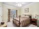 Bedroom with cozy four poster bed and natural light from the window with light yellow walls at 2785 Old Sewell Rd, Marietta, GA 30068